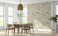 Decorative wall mural with colorful meadow flowers and playful bees.