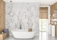 White Colour Flower Branches wallpaper mural of pink florals on grey behind a white freestanding tub in a wood-panelled bathroom