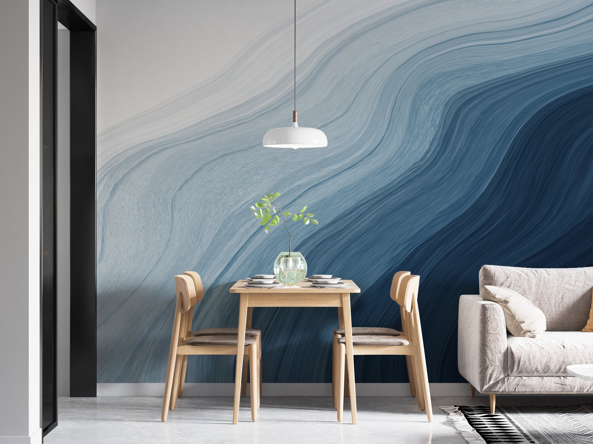 Fluid Blue Gradient Watercolor wallpaper mural behind a wooden dining table and chairs beside a grey sofa