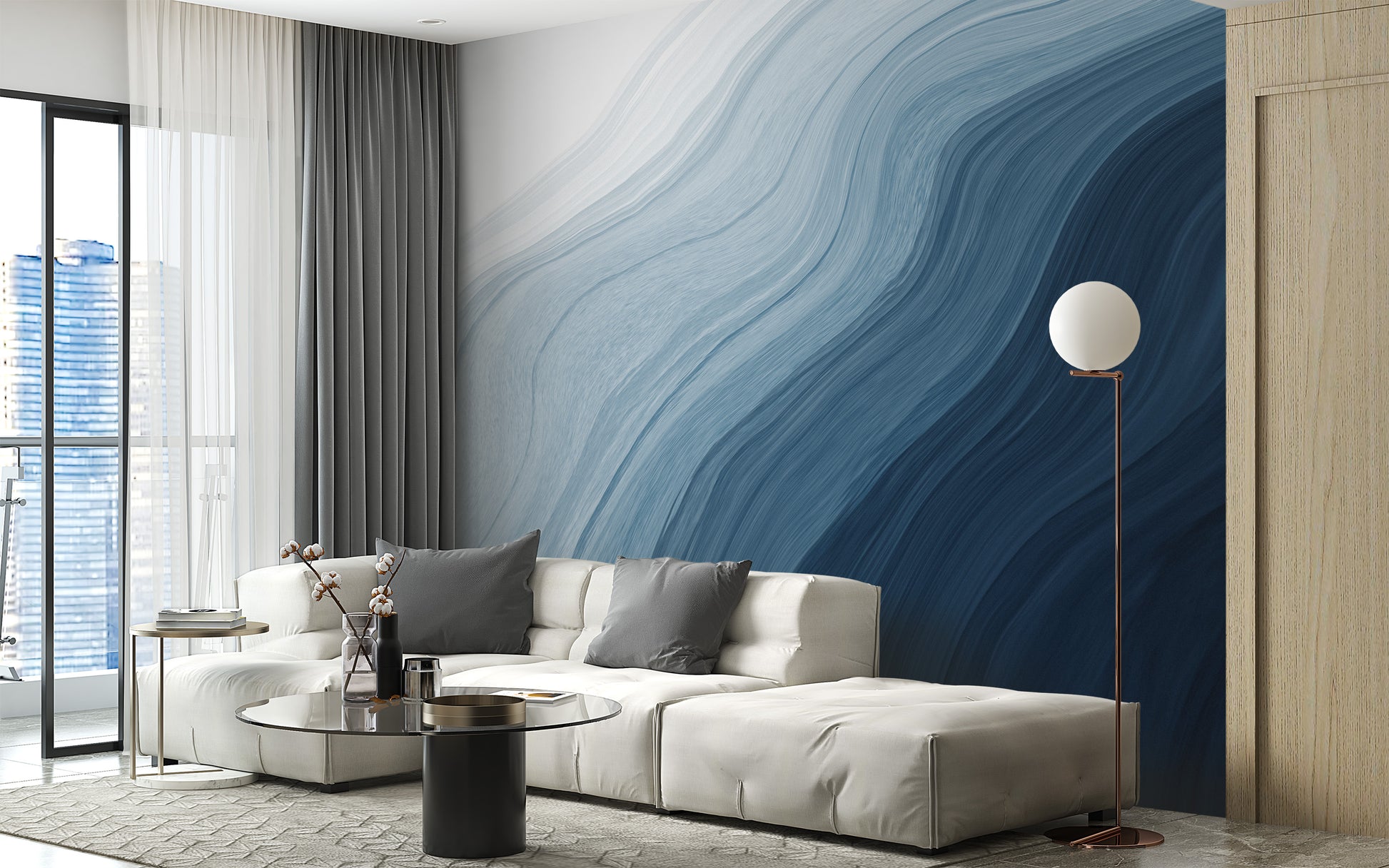 Fluid Blue Gradient Watercolor wallpaper mural behind a cream sectional sofa and globe floor lamp in a living room