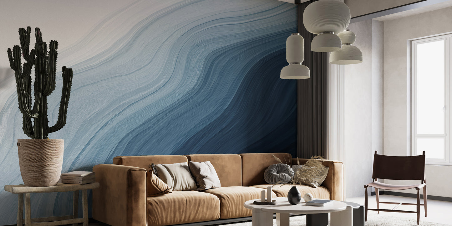 Fluid Blue Gradient Watercolor wallpaper mural behind a tan leather sofa and tall cactus in a modern living room
