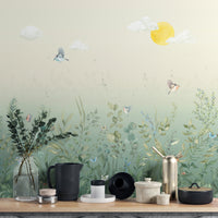 Removable self adhesive butterfly meadow pastel wall mural in a kitchen with a wooden counter and black accessories.