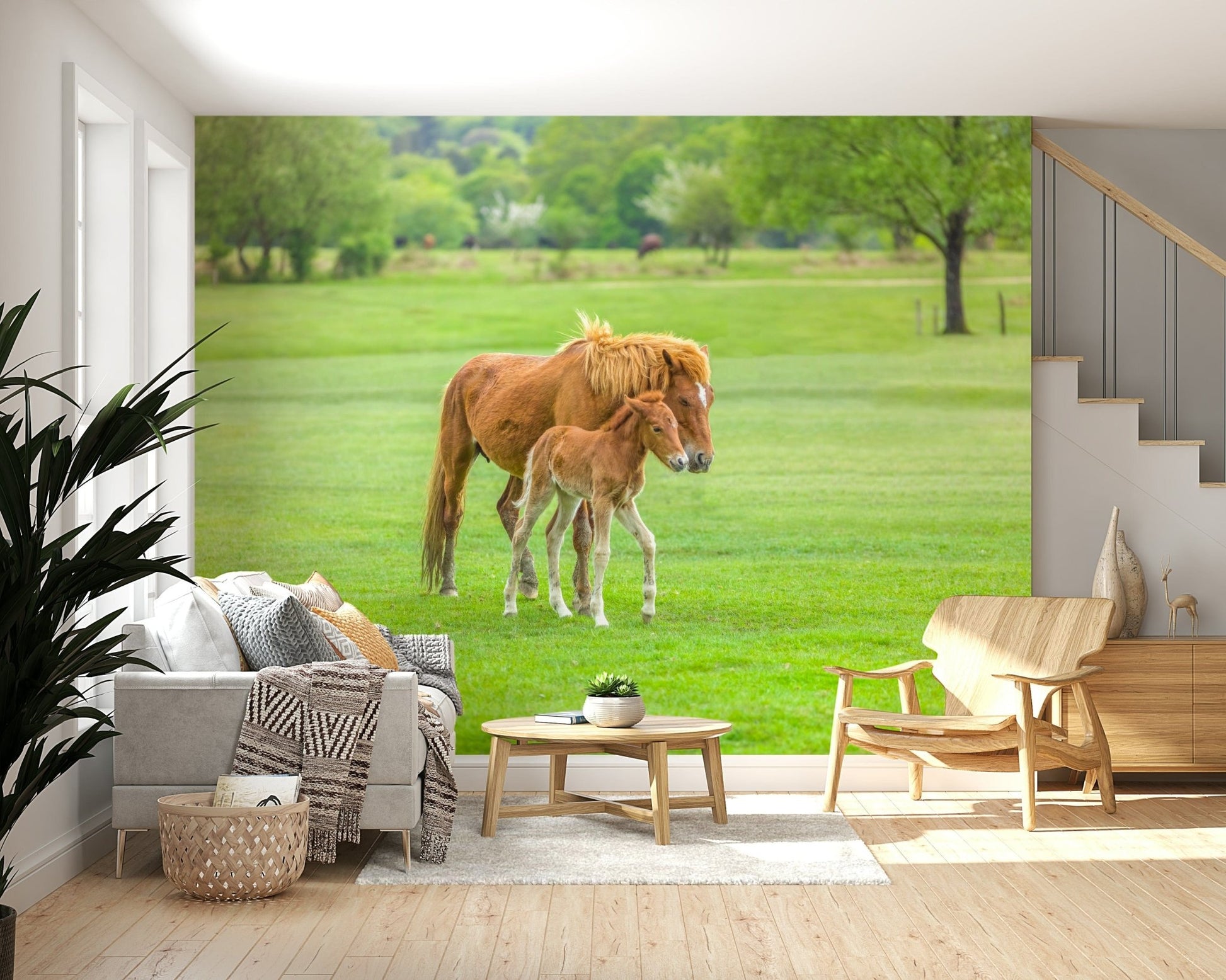 Foal mural behind crib, pastel sky and grass, calm nursery wallpaper