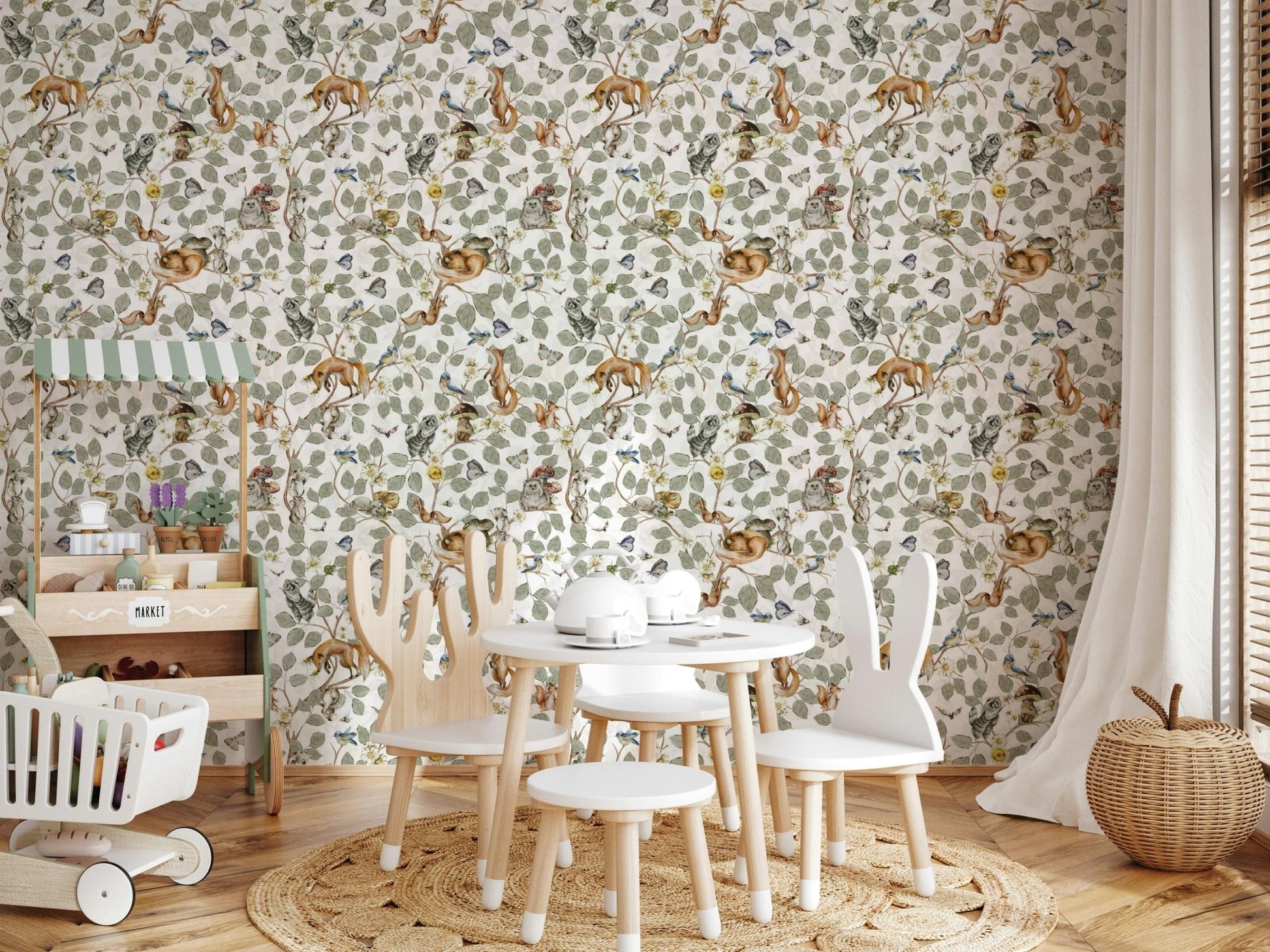 Kids room wallpaper with forest friends and leafy branches, blue-green color, cozy nook