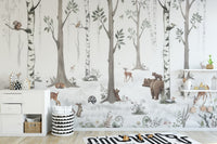 Forest Haven wallpaper mural of woodland animals in birch trees behind a white dresser and shelves in a kids room