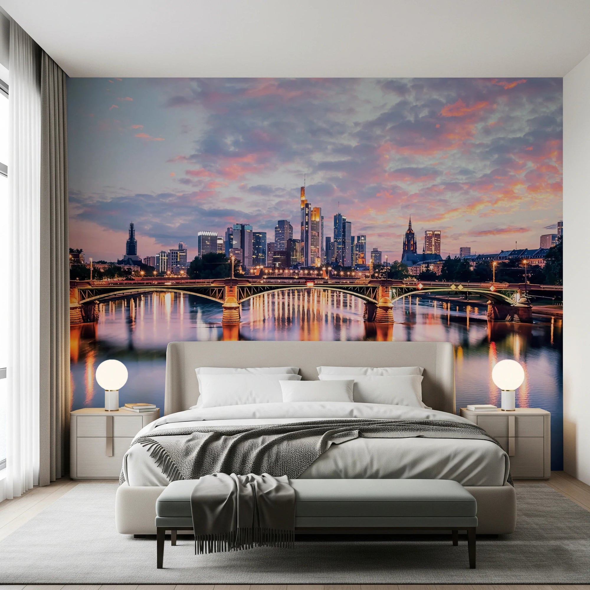 Frankfurt Dawn wallpaper mural of the sunset skyline and lit river bridge behind a grey bed in a bedroom