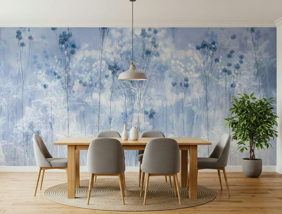 Frosted Dreams wallpaper mural of dreamy blue wildflowers behind a wood dining table with grey chairs in a dining room