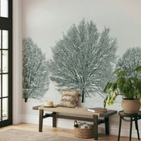 Frosty Trees Wall Mural with snow-covered branches and soft landscape.

