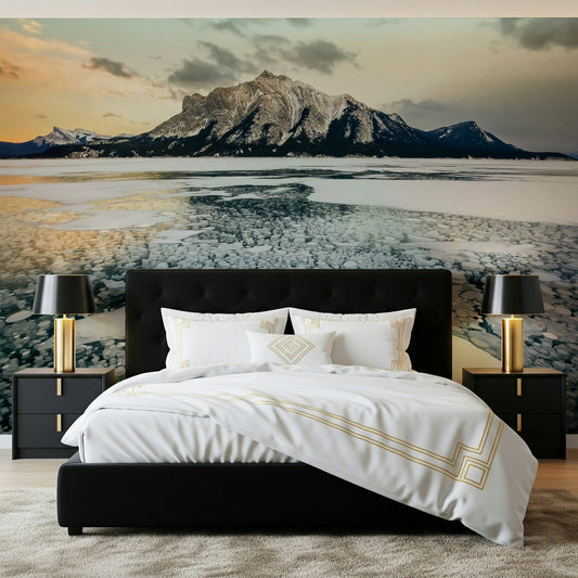 Frozen Bubbles: Mountain Vista wallpaper mural of a frozen lake and snowy mountain behind a black platform bed with gold lamps in a bedroom