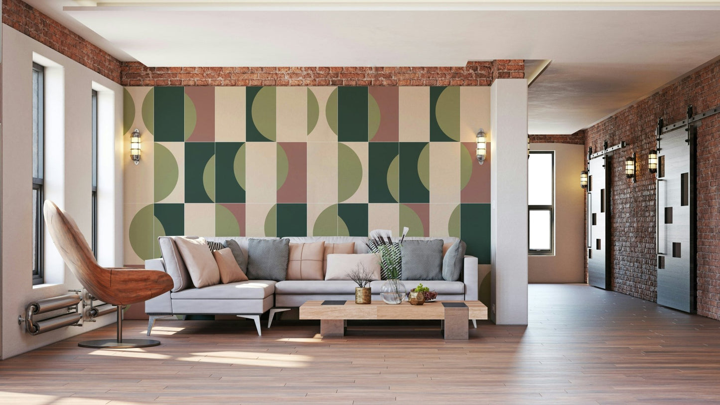 Garden Tiles 01 wallpaper mural with green and blush half-circle tiles behind a grey sectional in a loft living room