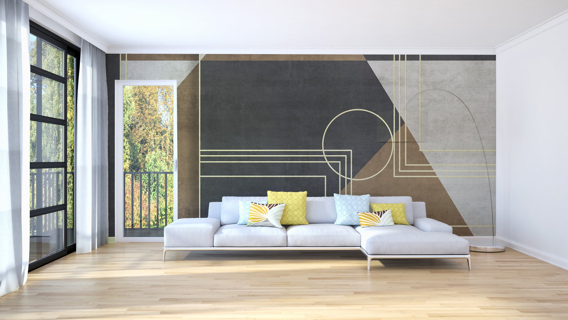 Geometric Abstraction wallpaper mural in charcoal and tan behind a white sectional sofa with yellow accent pillows