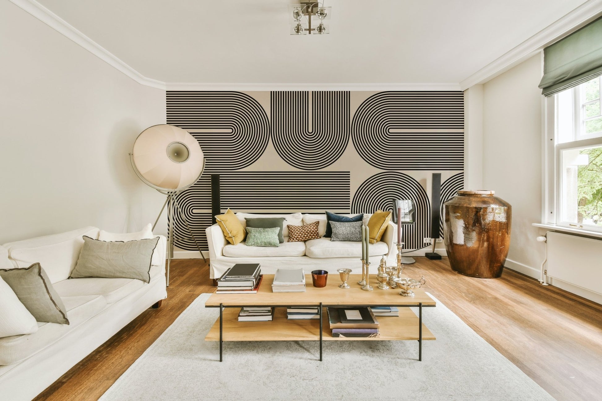 The colors are a sophisticated palette of soft grays and white.

