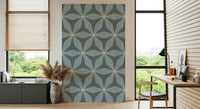 Stylish radiating lines wallpaper features a cool, pale blue surface.