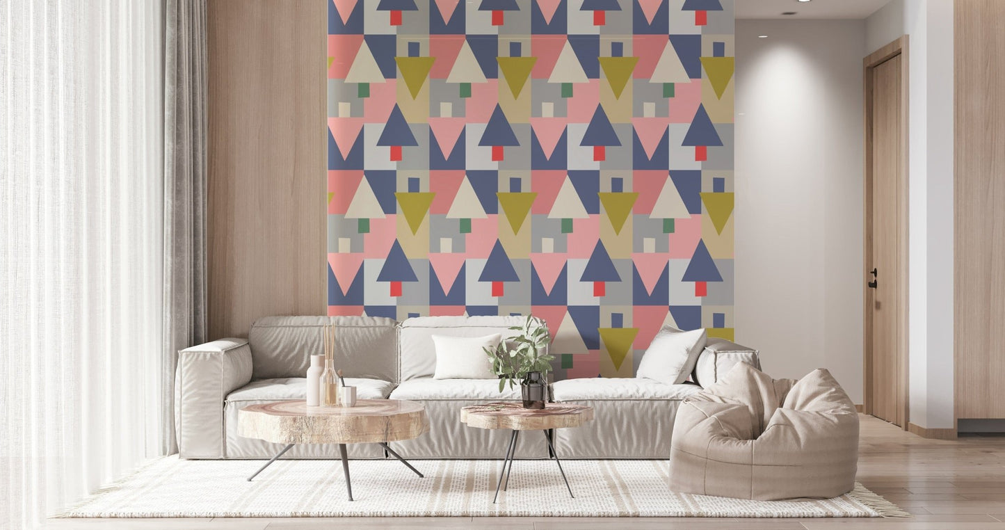 Geometric Forest Harmony wallpaper of mid-century triangles behind a cream sectional and round wood tables