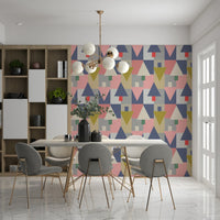 Geometric Forest Harmony wallpaper of triangle trees behind a marble dining table with grey gold-leg chairs