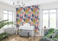 Geometric Forest Harmony wallpaper of pastel tree shapes behind a white upright piano with a grey bench