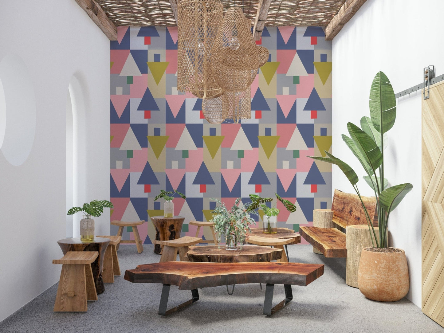 Geometric Forest Harmony wallpaper of pastel triangles in a lounge with live-edge wood benches and stools