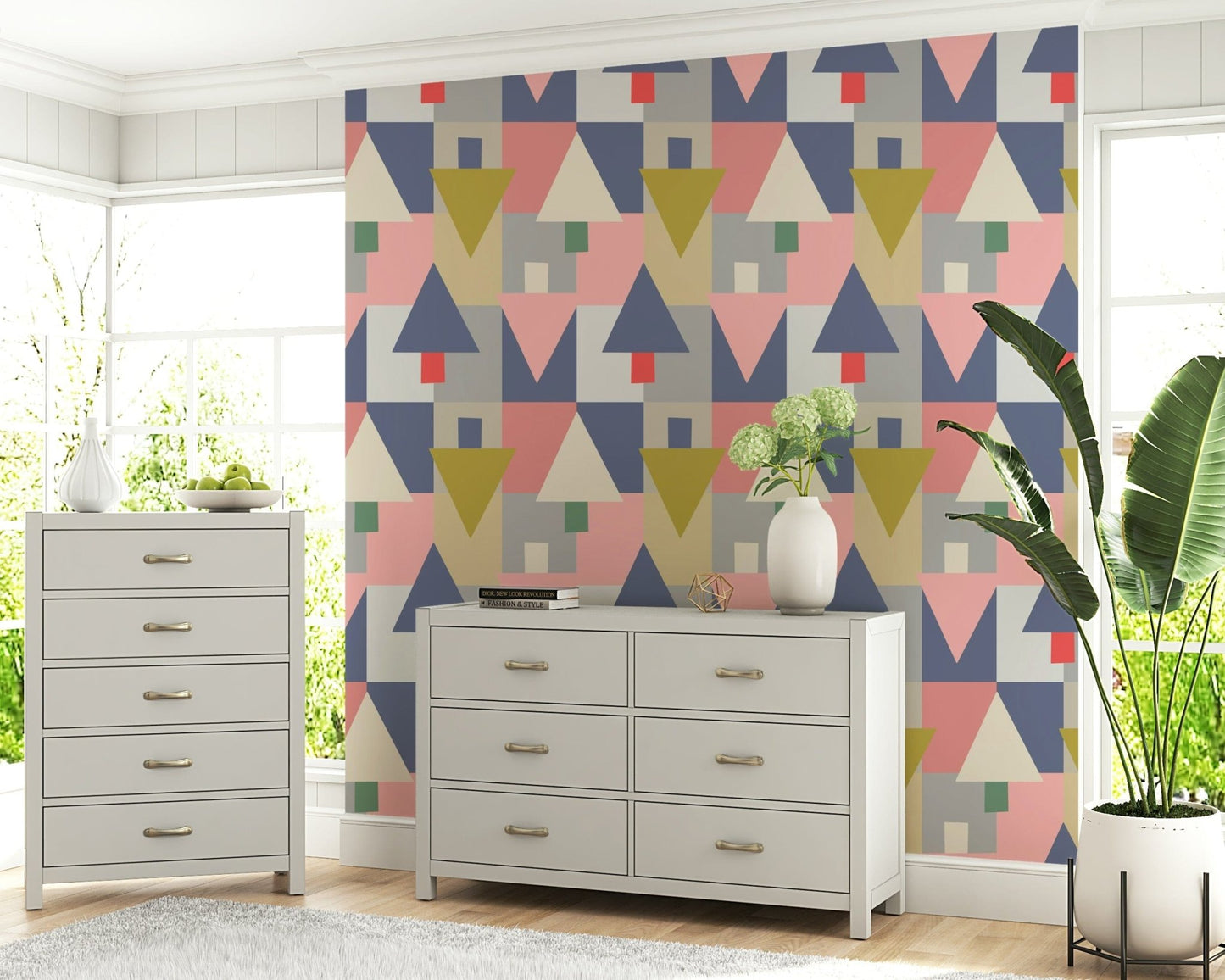 Geometric Forest Harmony wallpaper in pastel geometrics behind a grey dresser and tallboy with hydrangeas