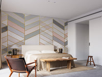 Geometric Shape Golden Effect Marble wallpaper mural with gold chevrons behind a beige bed in a bedroom