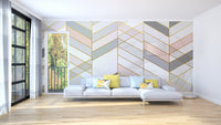 Geometric Shape Golden Effect Marble wallpaper mural behind a grey sectional sofa with yellow pillows
