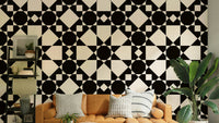 Retro art deco celestial star wallpaper in black cream.
