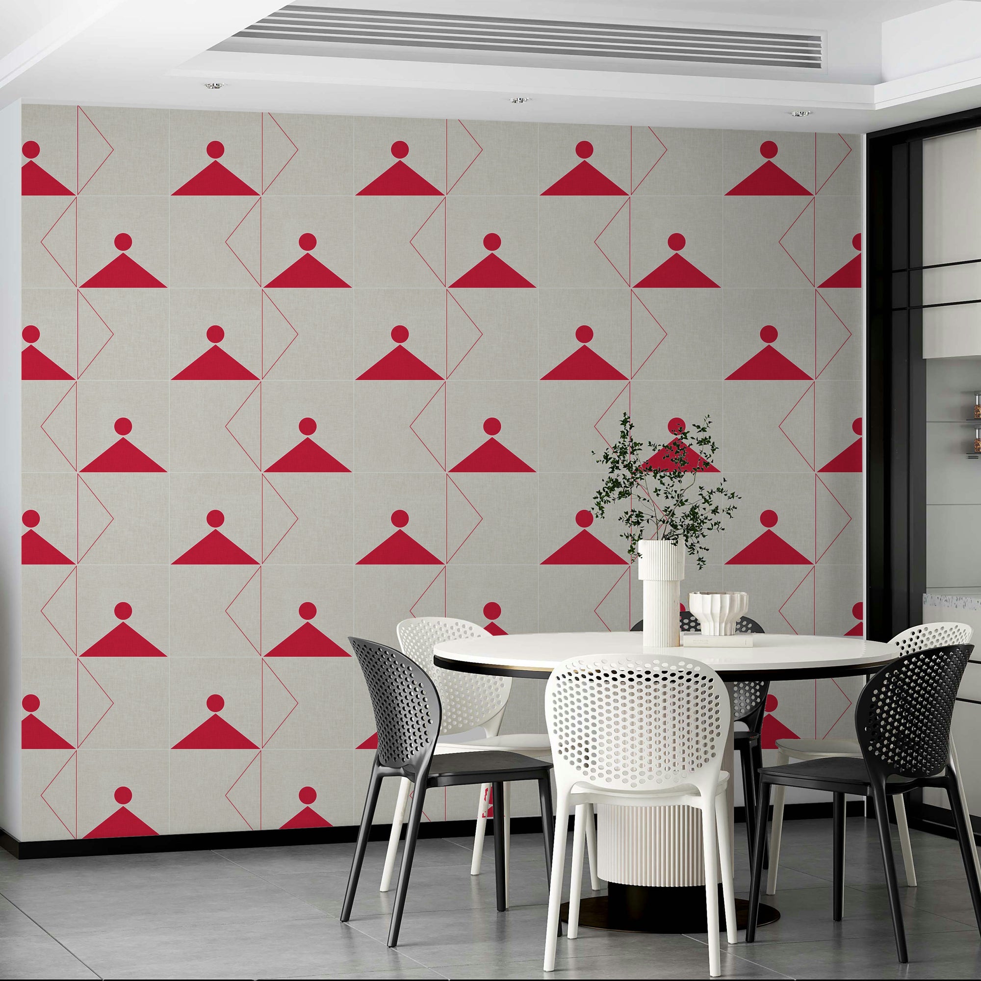 Geometric Textile wallpaper with red triangle motifs on cream in a dining room with black and white chairs