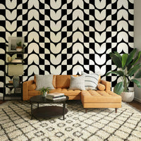 A living room decorated with a geometric wallpaper

