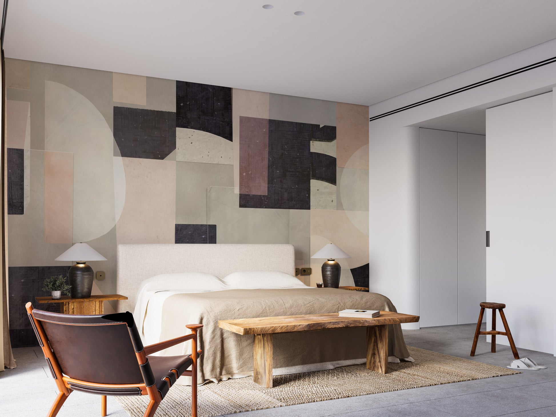 Modern Abstract wallpaper mural with muted geometric forms behind an upholstered bed and wooden bench in a calm bedroom