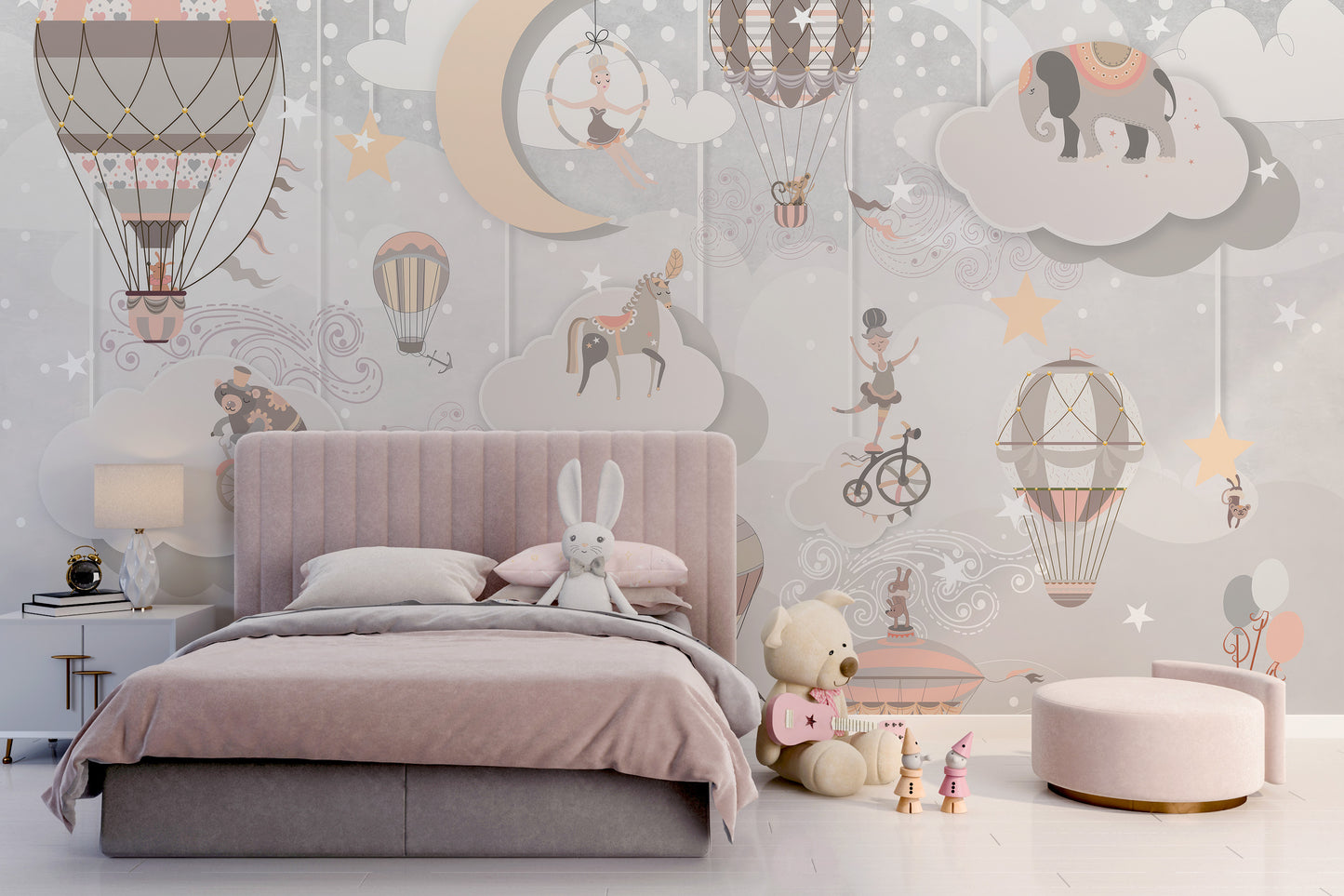 Starry Circus Spectacle mural in soft pink behind a child's upholstered bed with bunny and teddy in a nursery bedroom