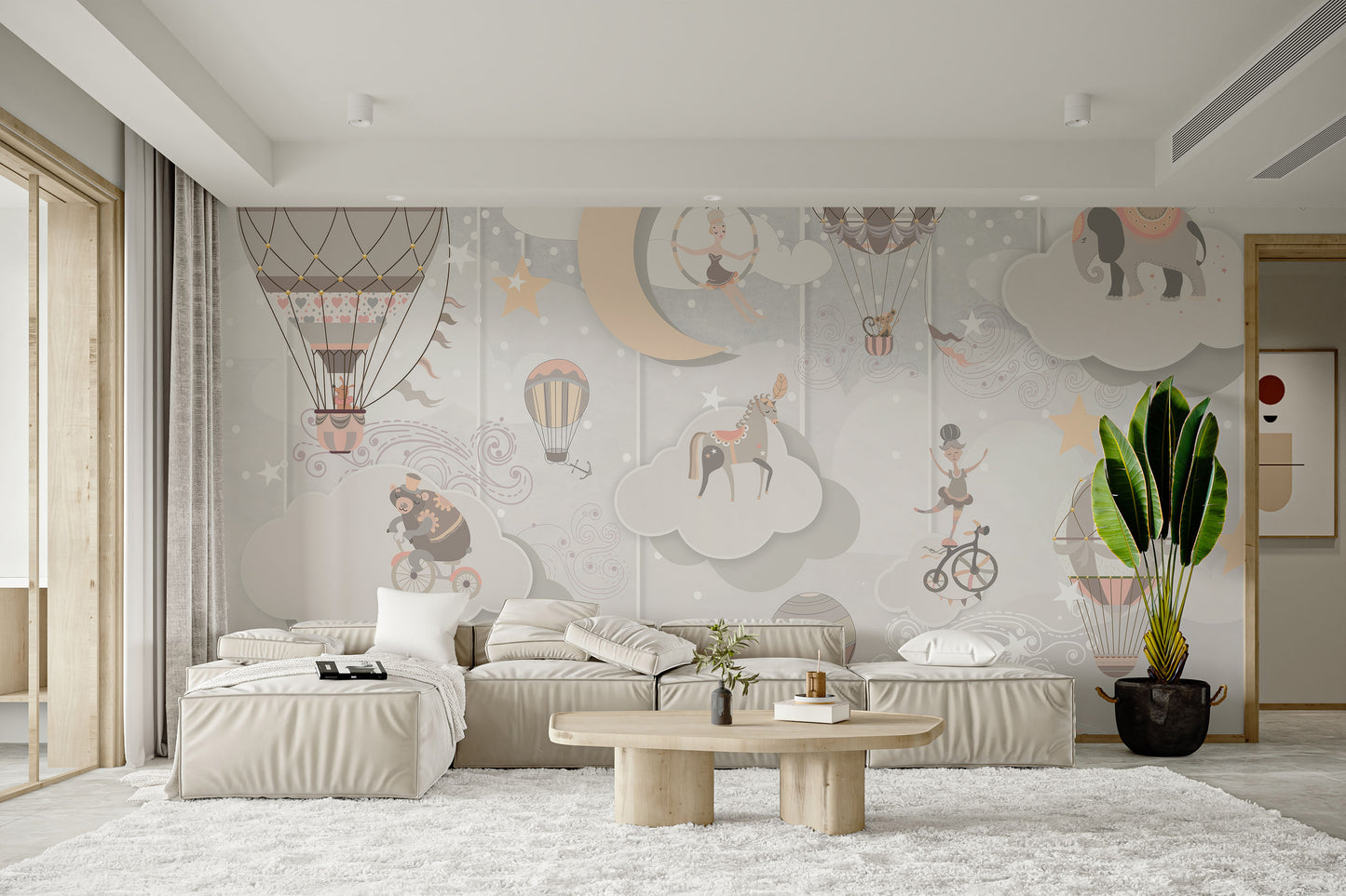 Starry Circus Spectacle mural of pastel balloons and acrobats behind a beige sectional sofa and round coffee table