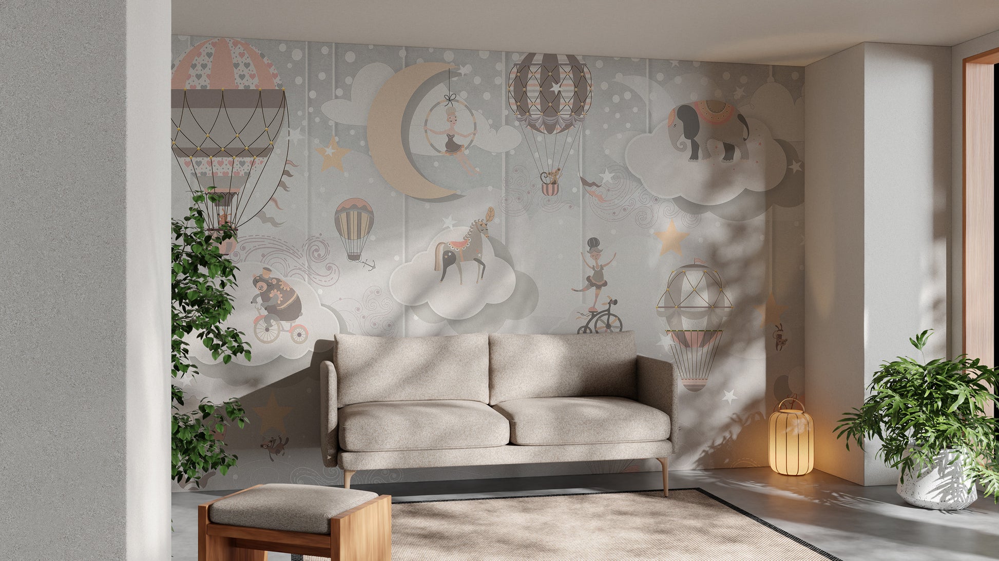 Starry Circus Spectacle mural in pastel pink and grey with balloons, moon and elephant behind a beige sofa in a living room