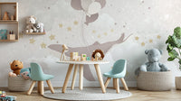 Whale Sky Parade nursery wallpaper mural in a playroom with mint kids table, chairs and woven toy baskets