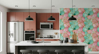 Contemporary wall covering featuring gilded accents on pink and turquoise watery textures
