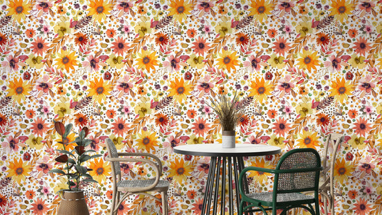 Big Sunflowers Floral Gold wallpaper behind a round bistro dining table with green and rattan chairs