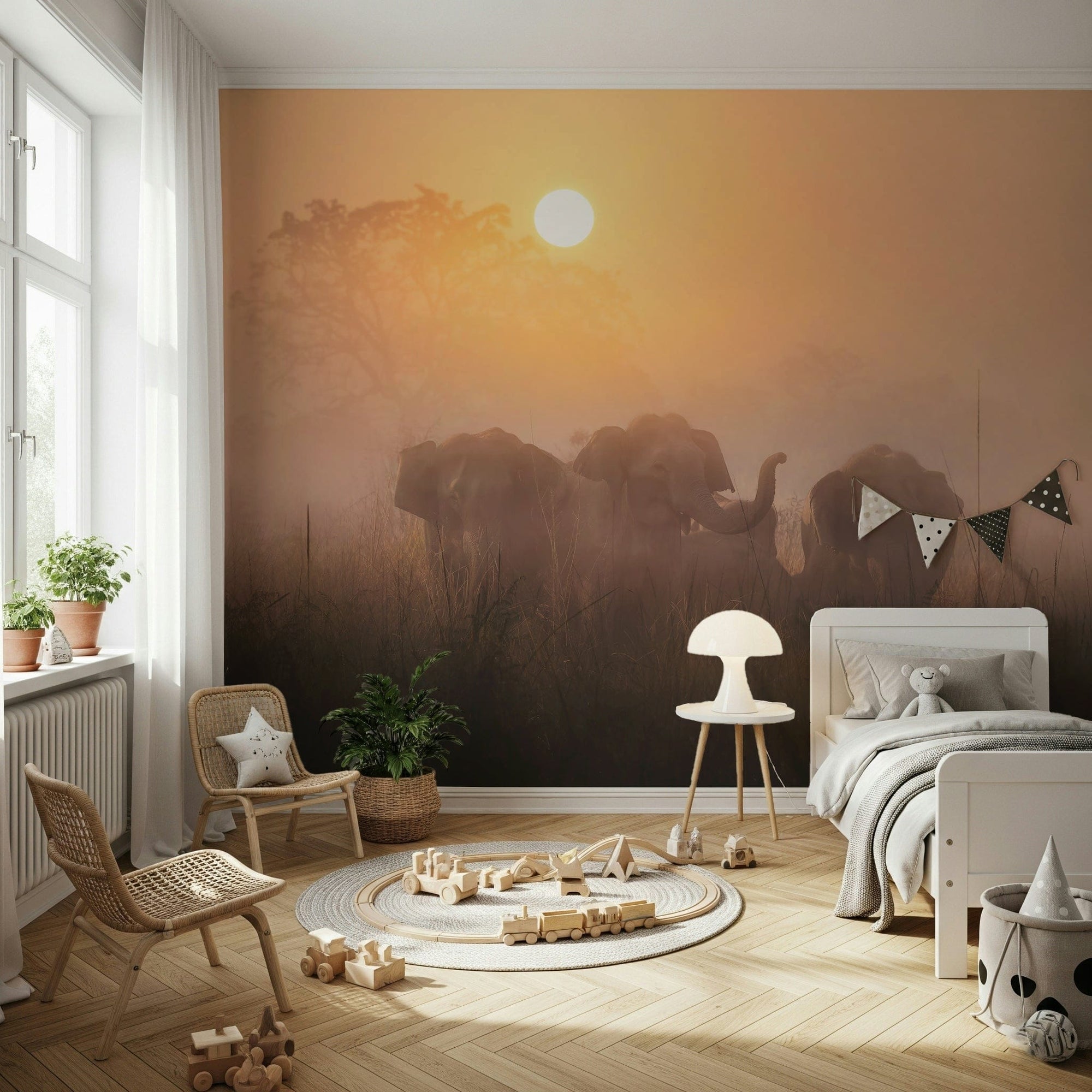Golden Dawn Elephants wallpaper mural of a misty sunrise safari behind a white kids bed with a teddy bear and rattan chairs