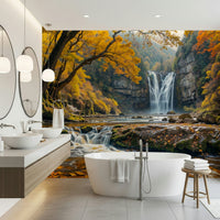 Golden Falls wallpaper mural of a waterfall and autumn forest behind a white freestanding tub in a bathroom