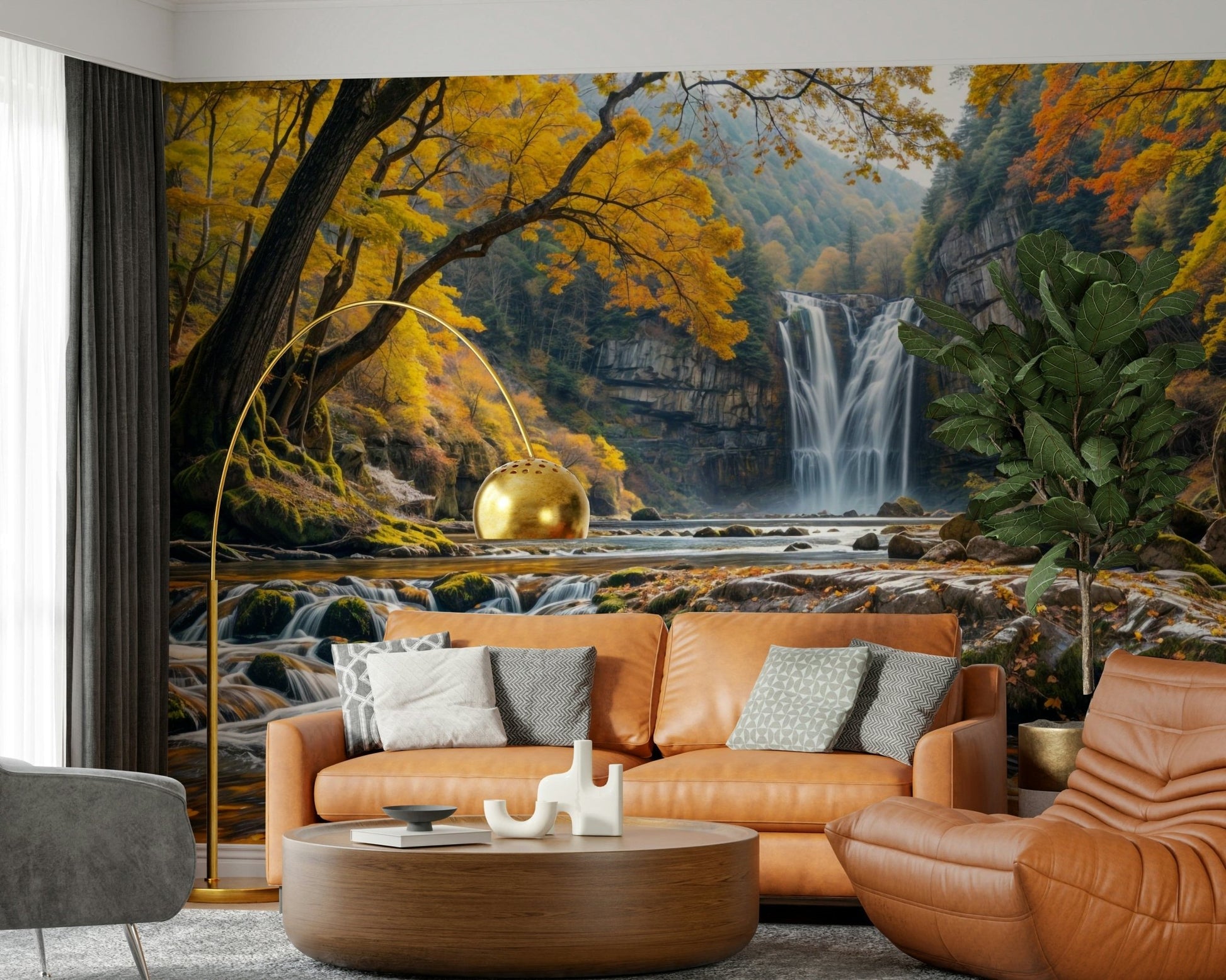 Golden Falls wallpaper mural of an autumn waterfall behind a cognac leather sofa and gold arc lamp