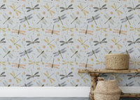 Dragonfly Damselfly Golden Gray wallpaper as a full-wall mural behind a rustic wood bench and seagrass baskets