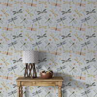 Dragonfly Damselfly Golden Gray wallpaper behind a wood console table with a chevron lamp and copper bowl