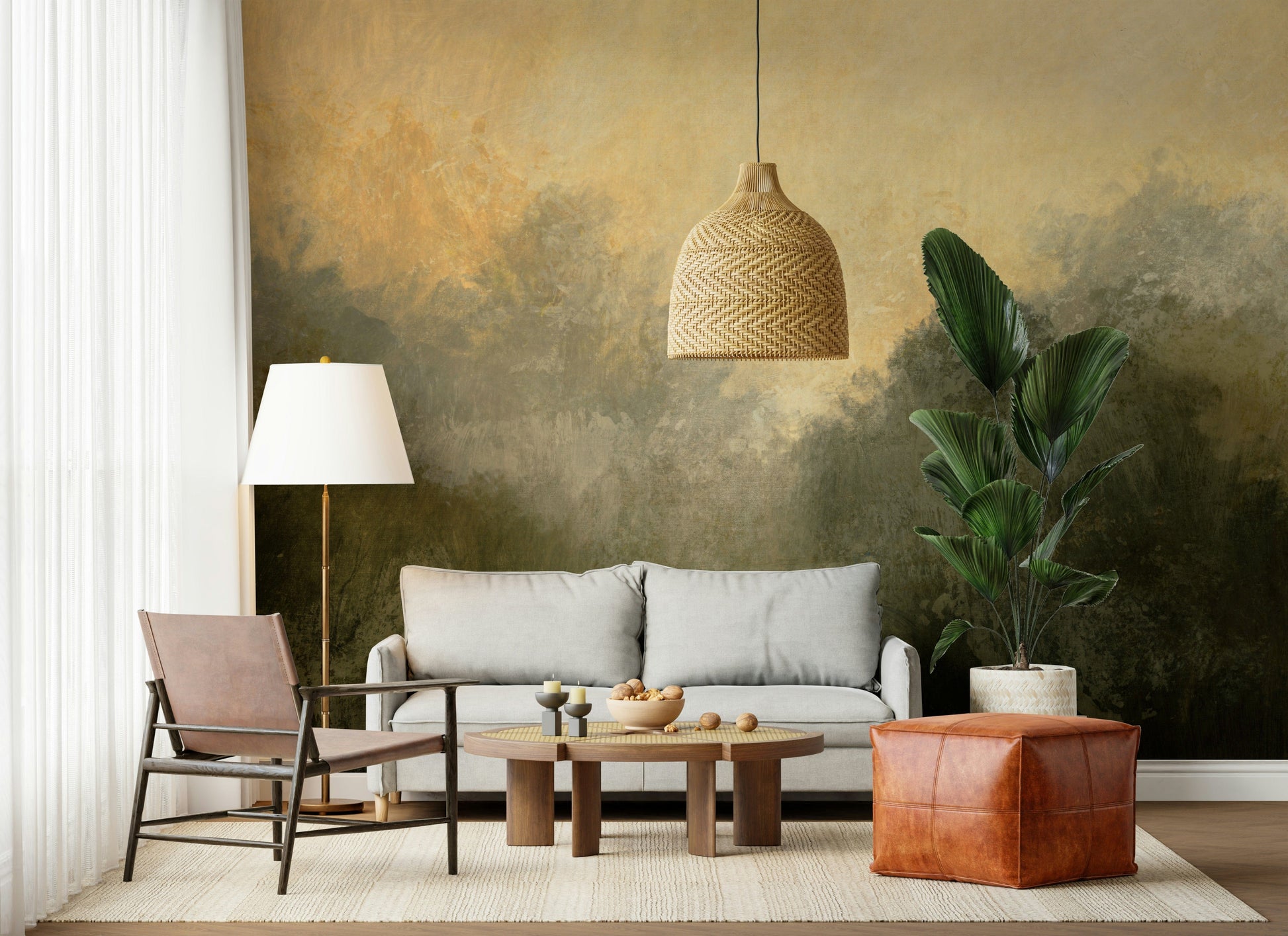 Golden Valley Haze wallpaper mural of dark misty trees behind a grey sofa and leather sling chair in a living room