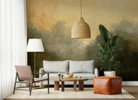 Golden Valley Haze wallpaper mural of dark misty trees behind a grey sofa and leather sling chair in a living room