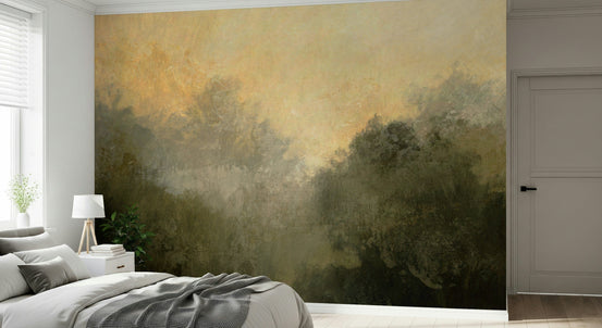 Golden Valley Haze wallpaper mural of misty treetops and amber sky above a grey bed and white nightstand in a bedroom