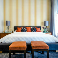 Minimalist vertical lines in soft yellow wallpaper


