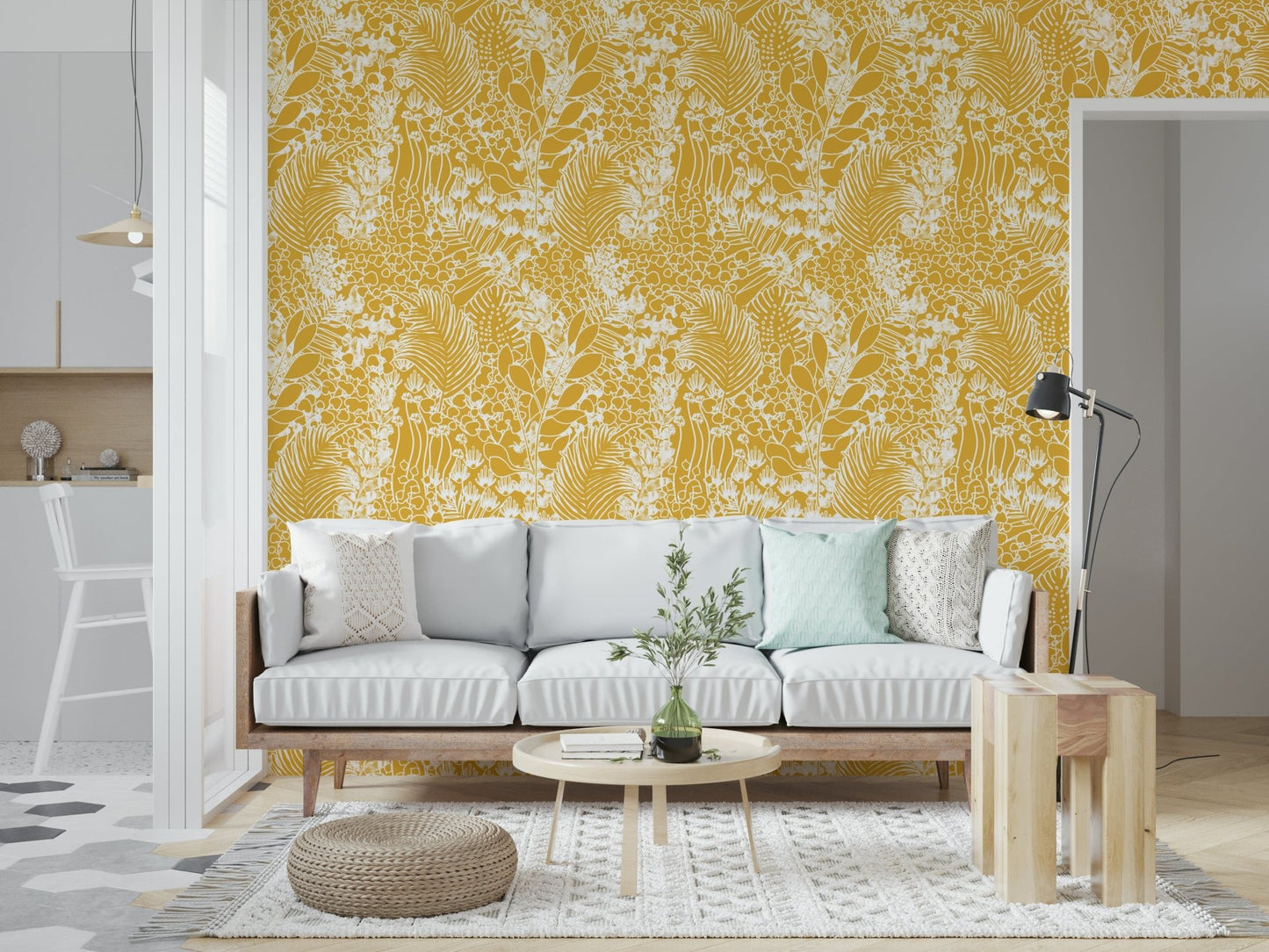 Golden Meadow Dream wallpaper in yellow and white behind a pale grey sofa with mint cushions and pouf