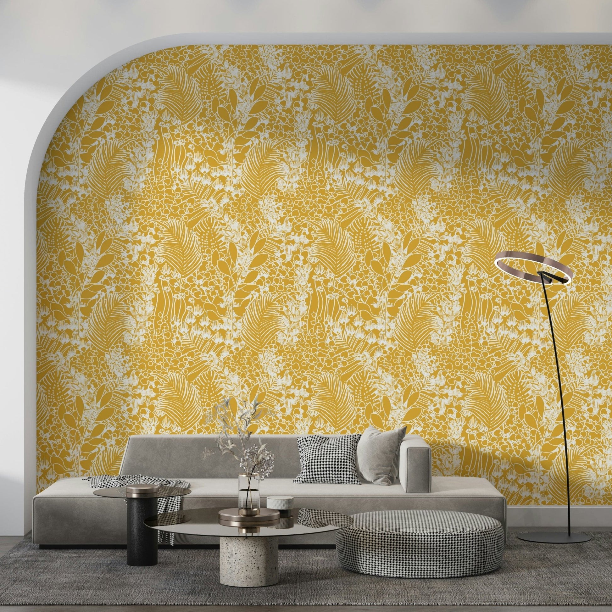 Golden Meadow Dream wallpaper in yellow foliage filling an arched alcove above a grey sofa and ottoman