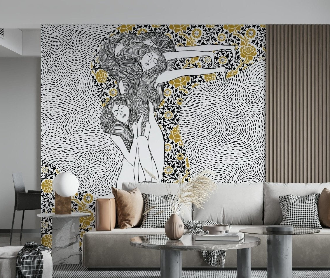 Golden Reverie wallpaper mural of dreaming women in black white and gold behind a beige sofa