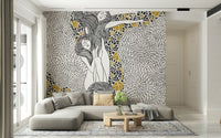 Golden Reverie wallpaper mural with gold accents behind a gray sectional with cream pillows