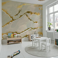 A modern abstract wall mural depicting a calming ecru sand and gold Marble Wallpaper pattern.