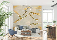 Detailed view of an ecru sand and gold abstract Marble Wallpaper, showing the luxe, swirling mineral pattern.