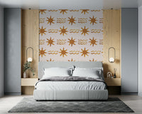 Flowing metallic gold waves beneath a soft sunrise-inspired design.